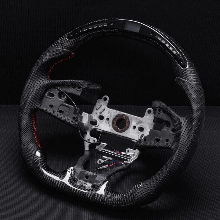 Carbon fiber steering wheel with perforated leather grip (15)