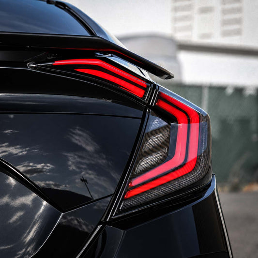 Smoked LED sequential taillights installed on 2016-2021 Honda Civic sedan, showing two-line design when illuminated (1)