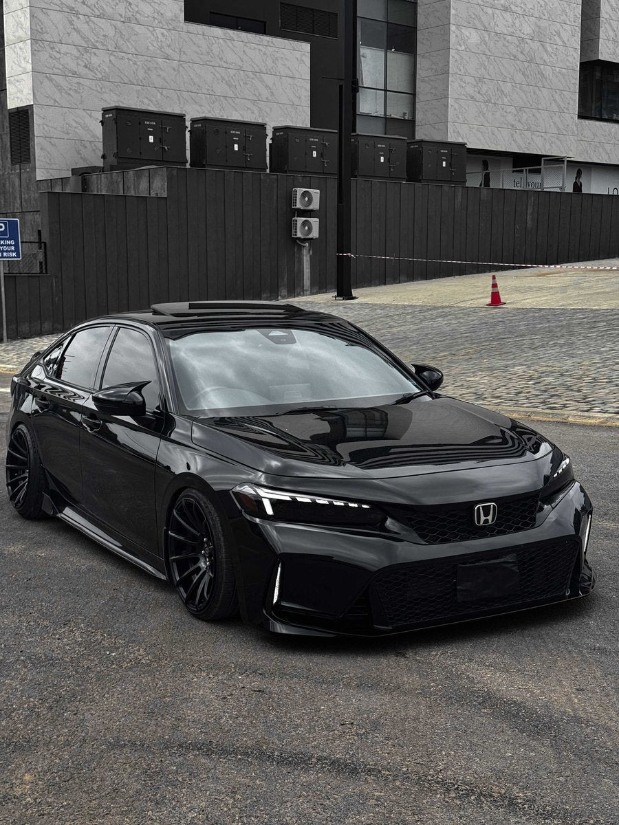 Black 11th gen Honda Civic with UMS v2 sequential LED headlights installed, front three-quarter view
