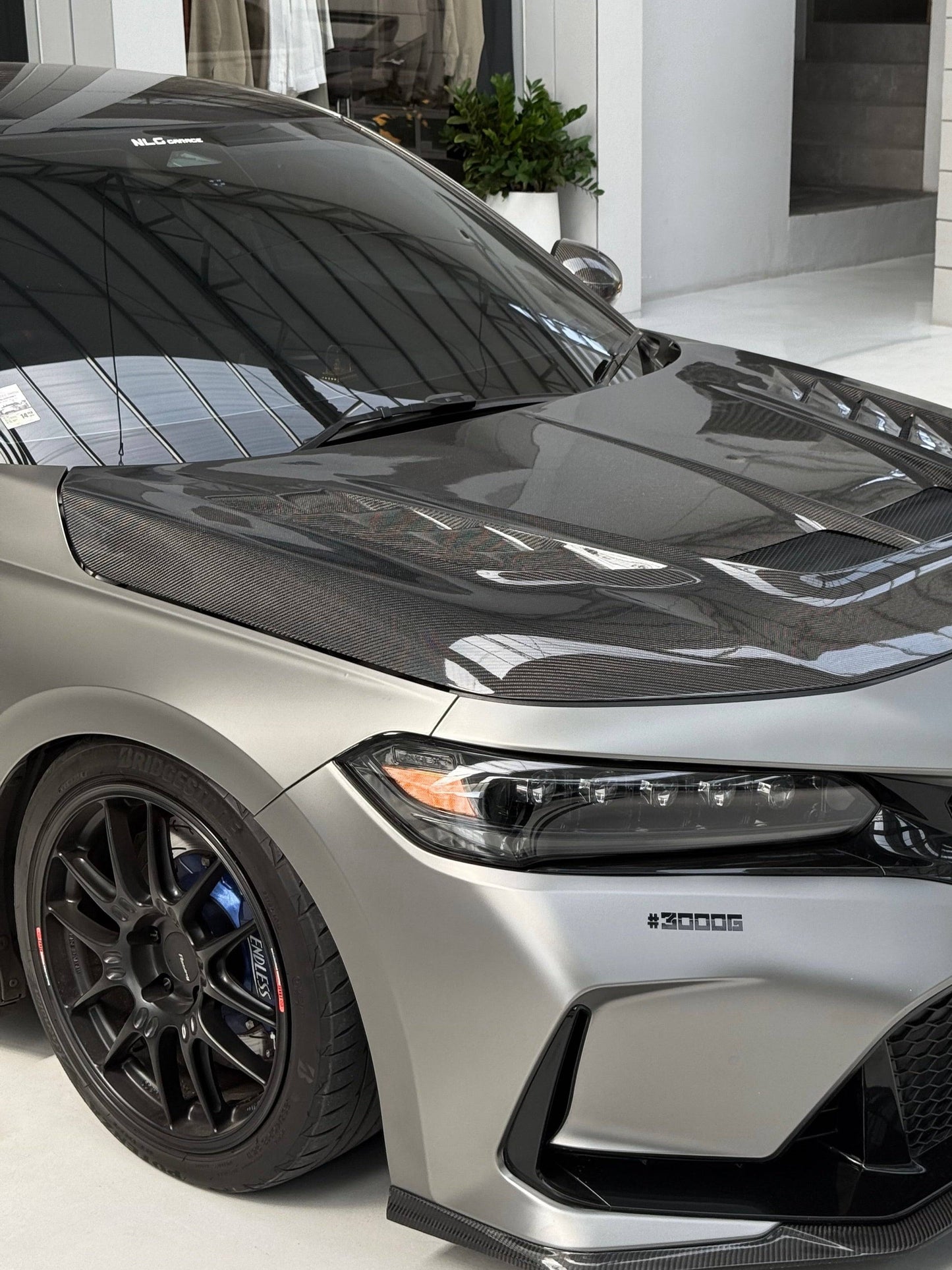 UMS carbon fiber hood V2 opened on 2023+ Honda Civic Type R FL5, gloss weave visible