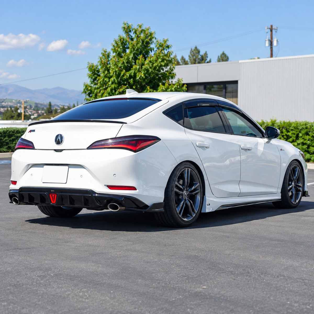 Gloss black LED rear diffuser with shark fin extensions installed on Acura Integra rear bumper (2)