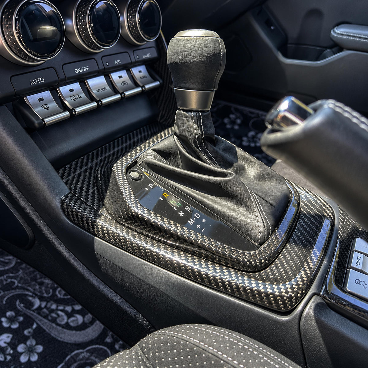 Carbon fiber shift console panel trim installed in Toyota GR86 interior (1)
