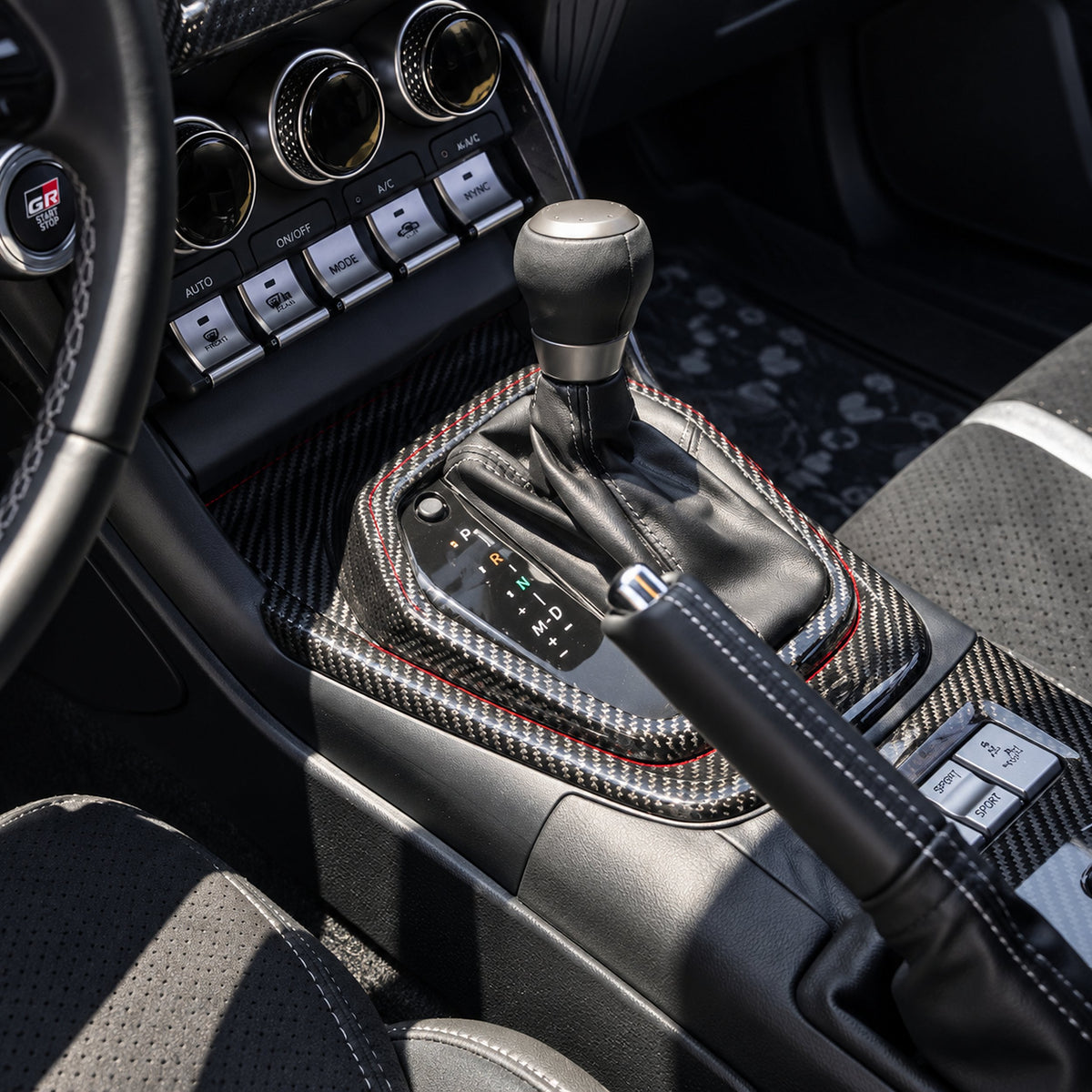 Carbon fiber shift console panel trim installed in Toyota GR86 interior (3)