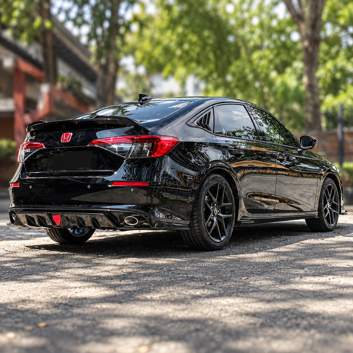 Pair of gloss black side skirt extensions installed on Honda Civic sedan (1)