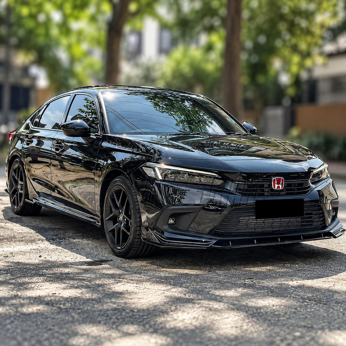 Pair of gloss black side skirt extensions installed on Honda Civic sedan (3)