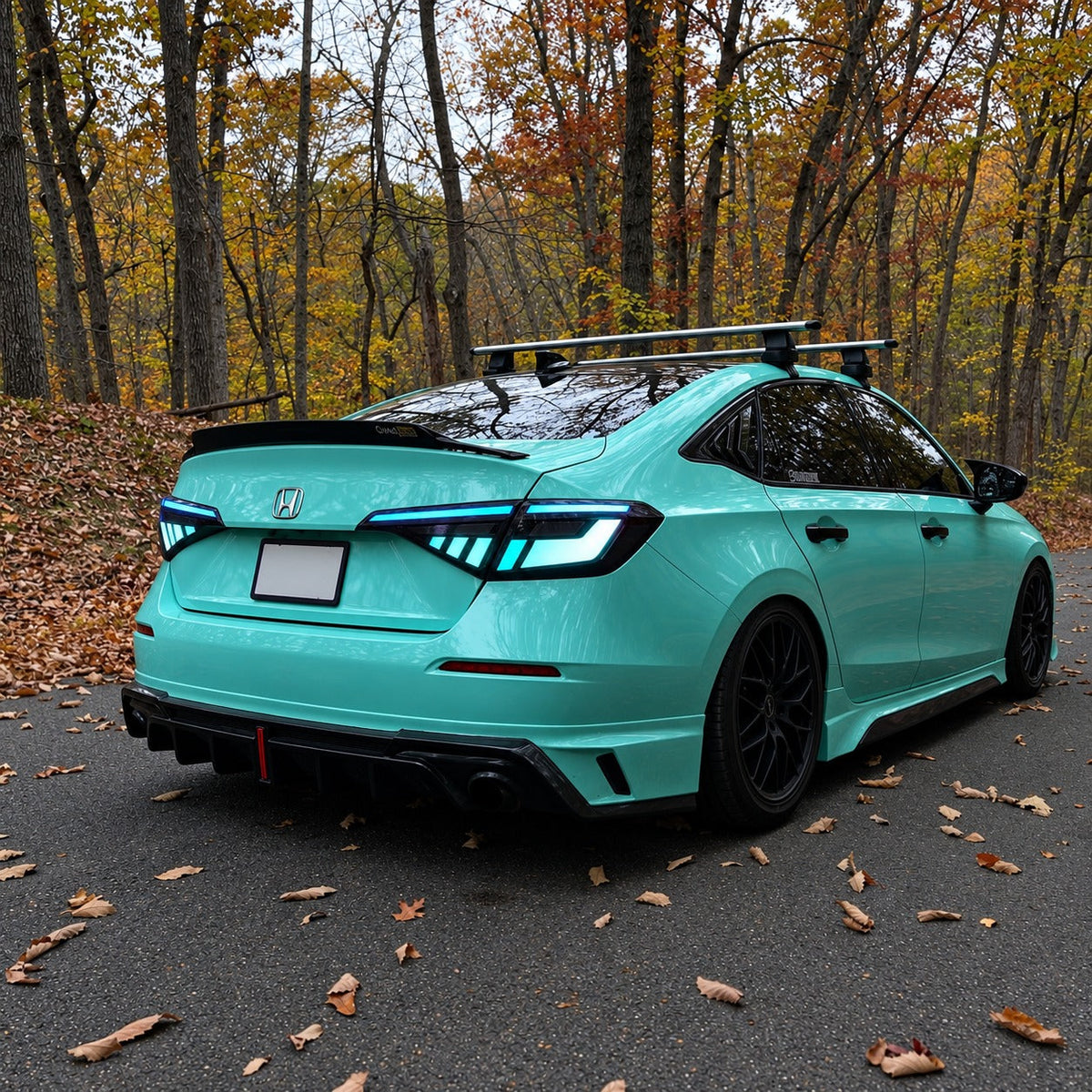 Pair of RGB sequential taillights with red and blue lighting effects installed on Honda Civic sedan (1)