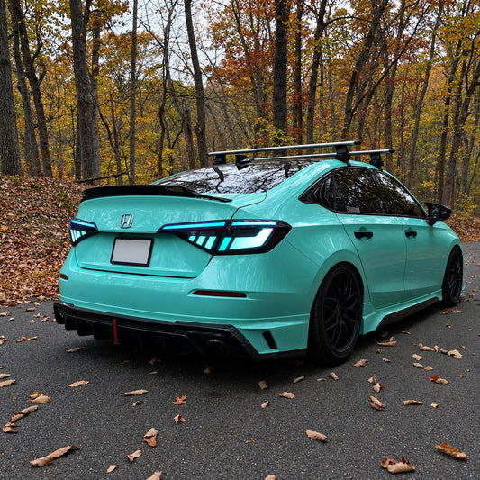 Pair of RGB sequential taillights with red and blue lighting effects installed on Honda Civic sedan (1)