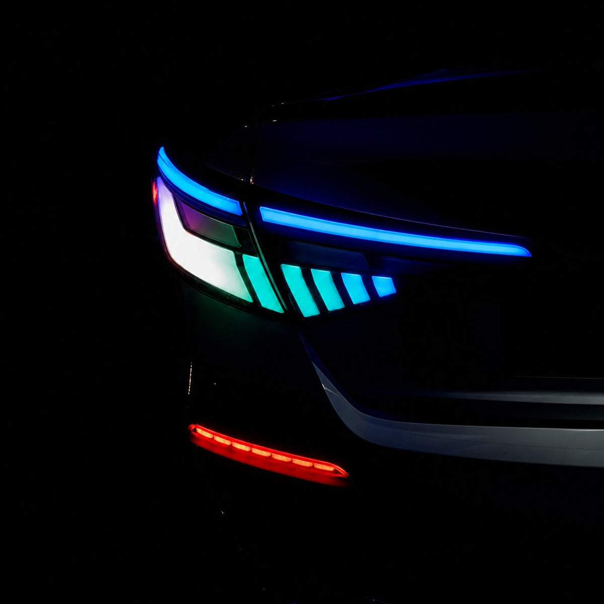 Pair of RGB sequential taillights with red and blue lighting effects installed on Honda Civic sedan (6)