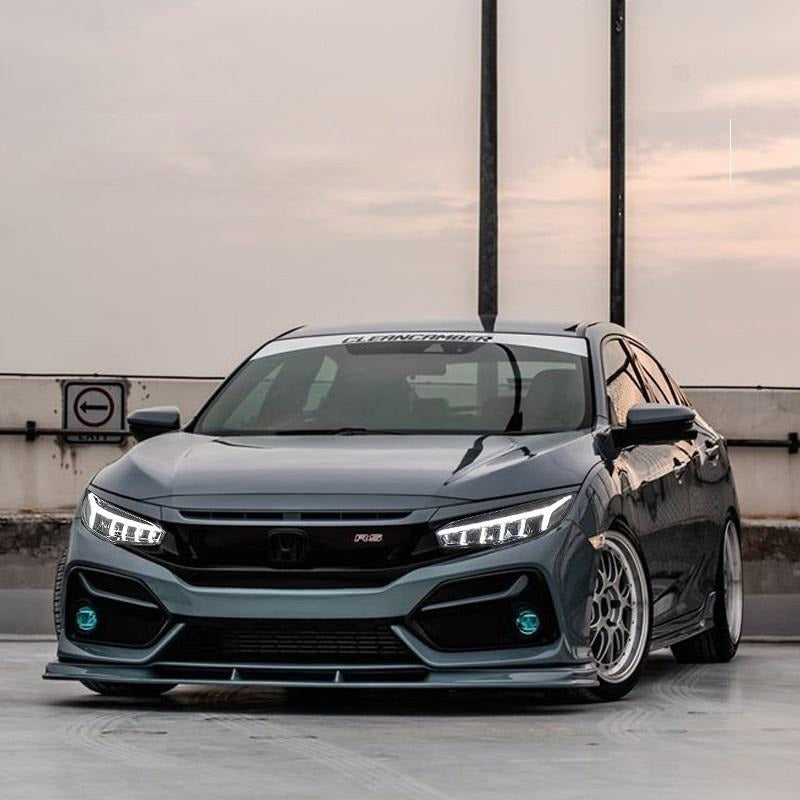 Front three-quarter view of a dark gray 10th Gen Civic with sequential dragon headlights