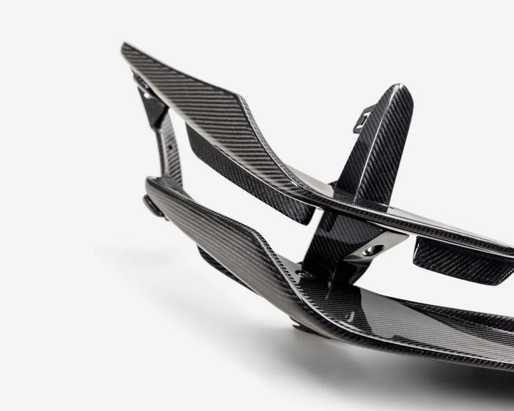 Seibon carbon fiber front bumper canards installed on Honda Civic, showing gloss finish detail (3)