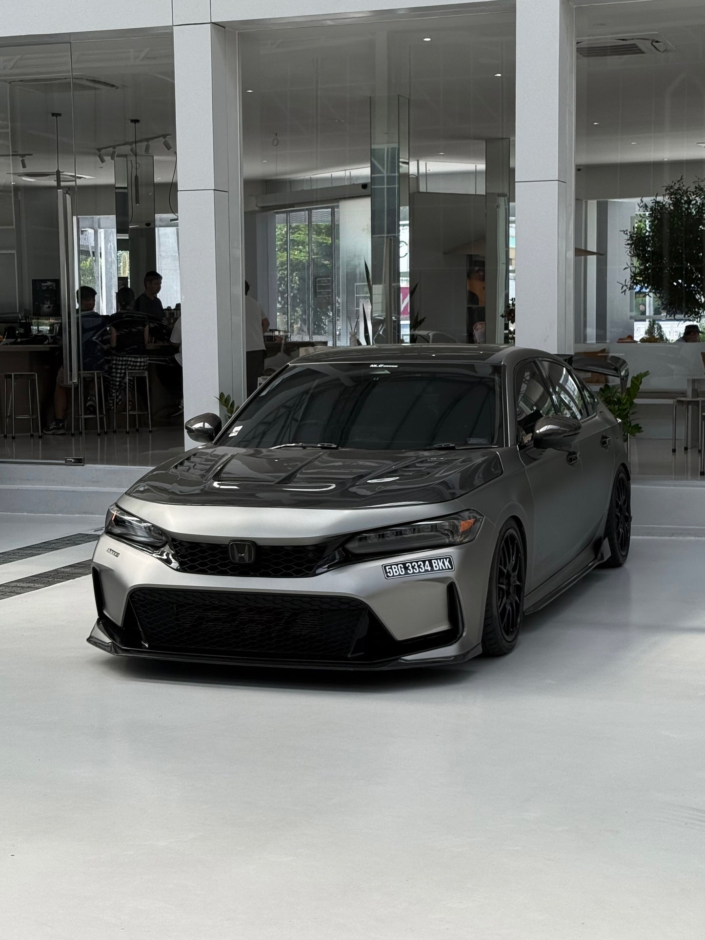 Carbon fiber hood with ventilation on 2023+ Honda Civic Type R, three-quarter front view