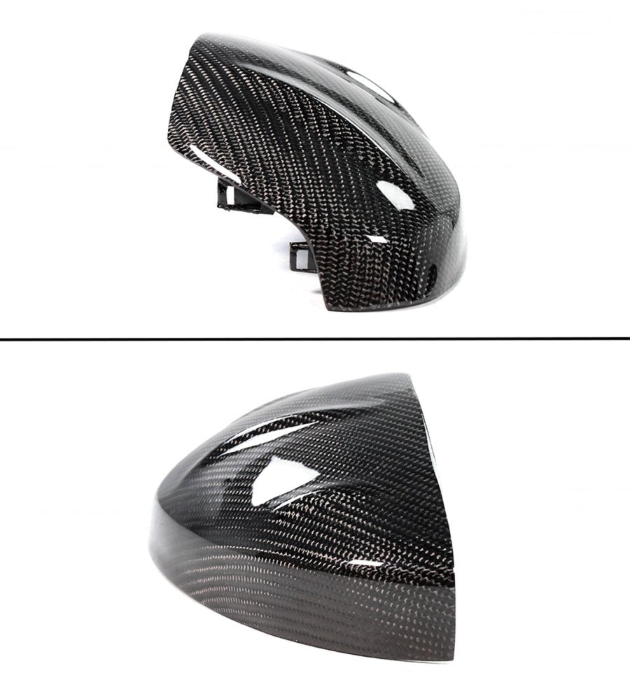 Two angled views of glossy black carbon fiber Acura Integra mirror caps with mounting tabs
